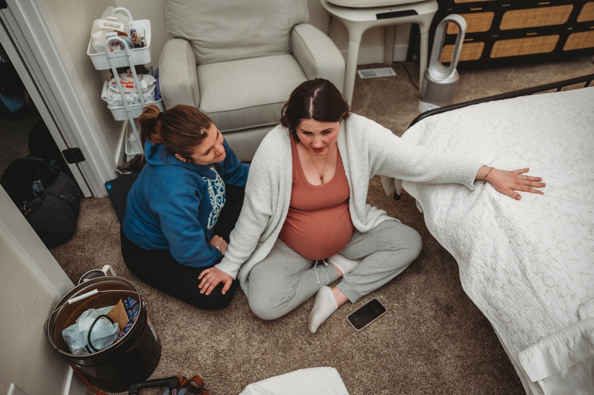 parent supported by their doula during labor